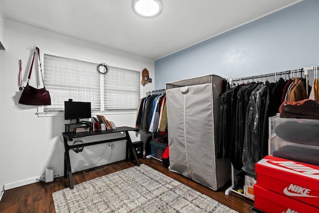 interior space with wood finished floors and baseboards