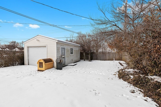 exterior space with a garage and fence