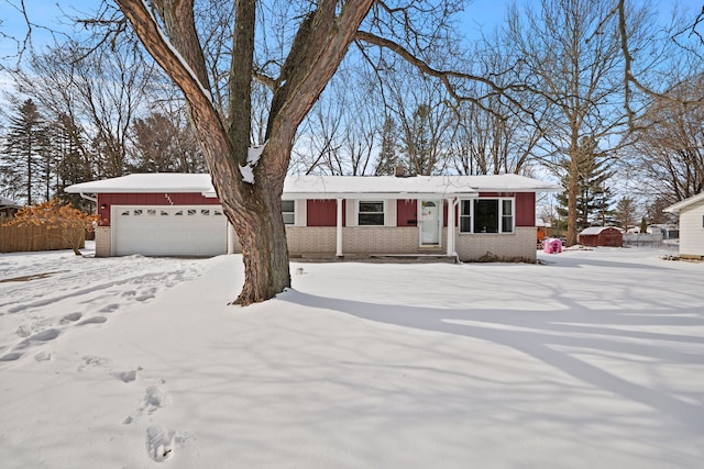 ranch-style house with an attached garage and brick siding