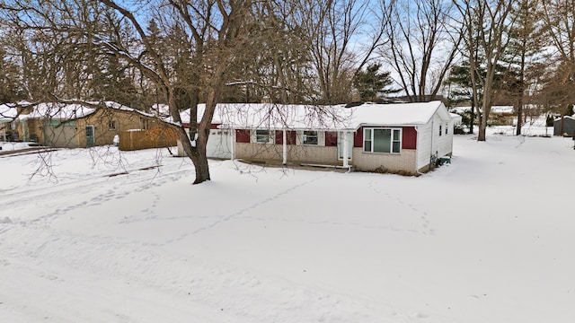 single story home with a garage and brick siding