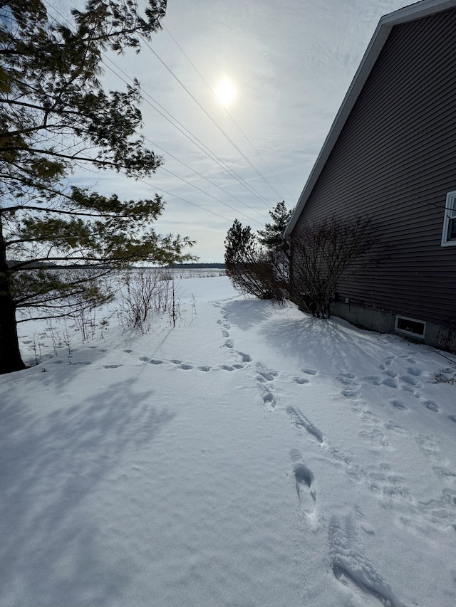 view of yard layered in snow