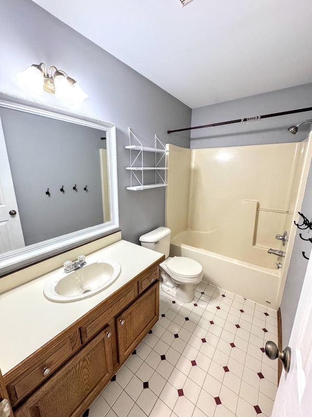 bathroom featuring toilet, vanity, and washtub / shower combination