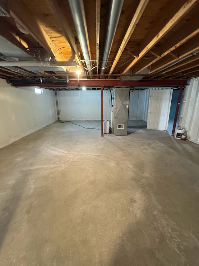 basement featuring heating unit