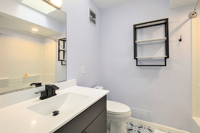 bathroom with toilet, visible vents, walk in shower, and vanity