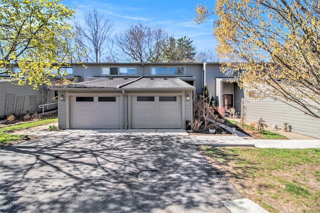 view of front facade with an attached garage and driveway