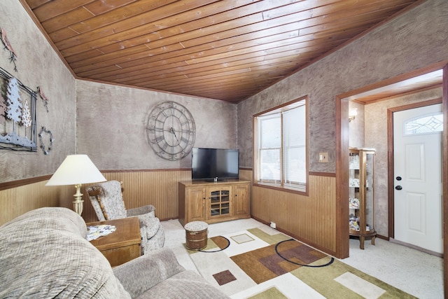 living room featuring light carpet, wood walls, wood ceiling, and wainscoting