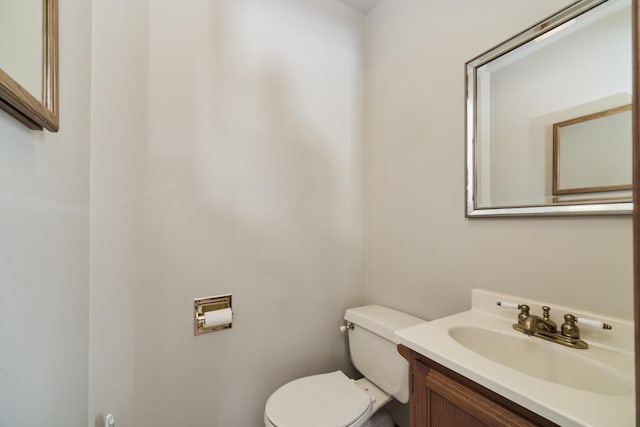 half bath with vanity and toilet