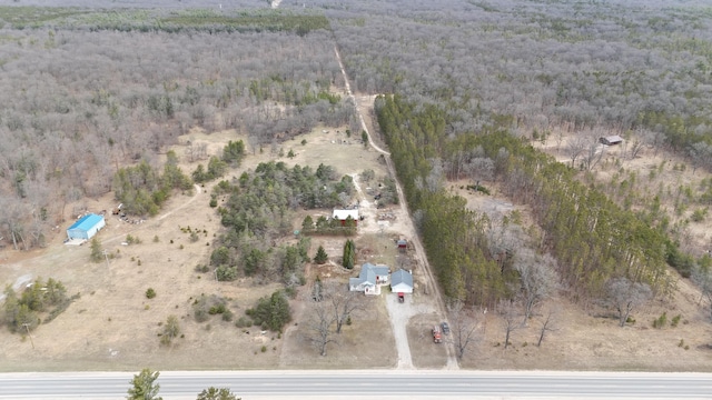 drone / aerial view with a rural view and a wooded view