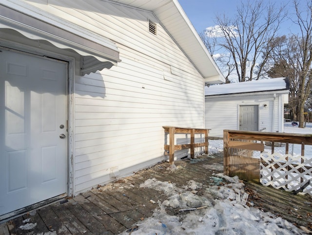 view of snow covered property entrance