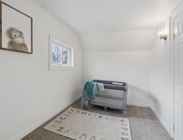 sitting room with light carpet, baseboards, and vaulted ceiling