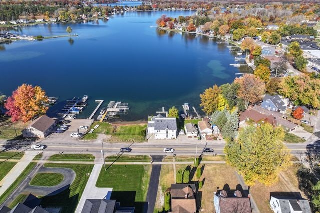 bird's eye view featuring a water view and a residential view