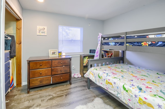 bedroom with wood finished floors