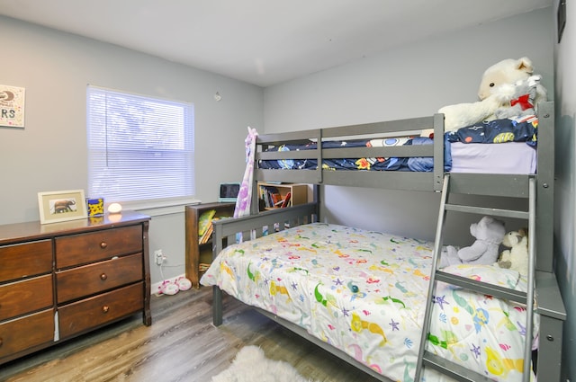 bedroom featuring wood finished floors