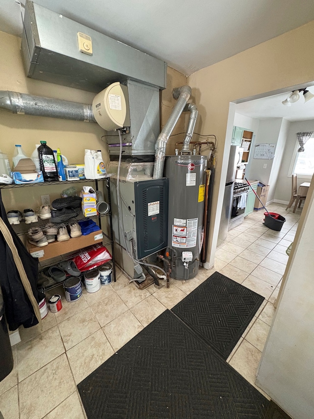 utility room featuring water heater