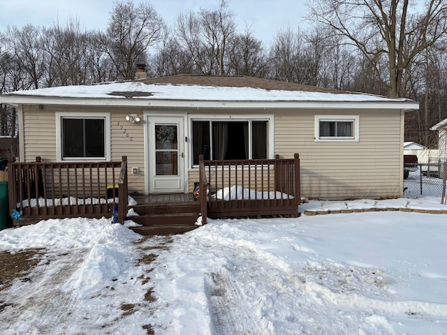 view of front of property featuring a wooden deck