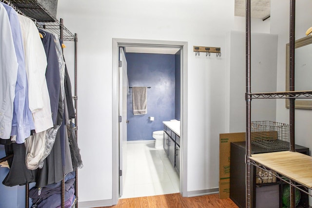spacious closet with wood finished floors