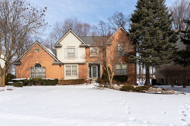 traditional-style house with brick siding