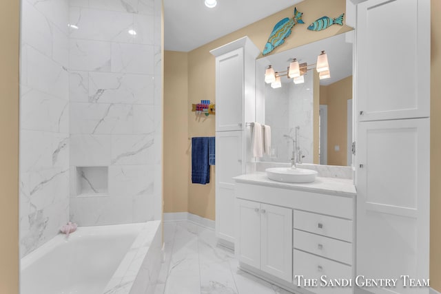 bathroom featuring marble finish floor, baseboards, and vanity