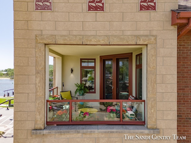 doorway to property with a water view