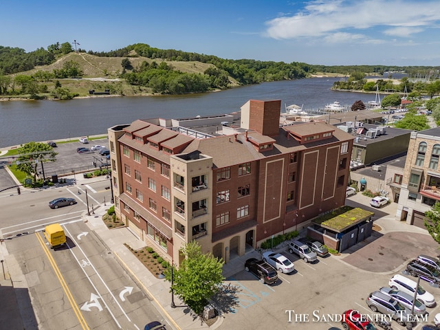 birds eye view of property with a water view