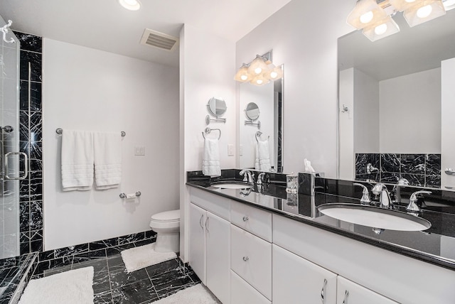 full bath with toilet, visible vents, marble finish floor, and a sink