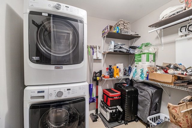 laundry room with laundry area and stacked washing maching and dryer