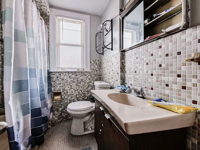 full bathroom featuring toilet, plenty of natural light, tile walls, and tile patterned floors