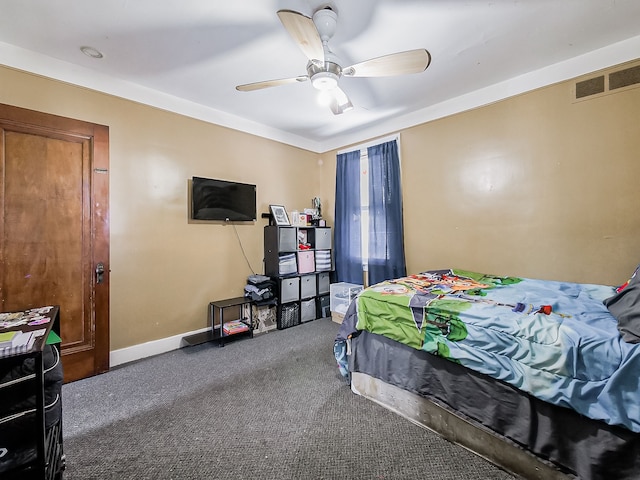 carpeted bedroom featuring ceiling fan, visible vents, and baseboards