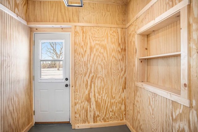 doorway to outside with concrete flooring