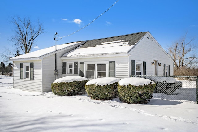 view of front of house featuring fence