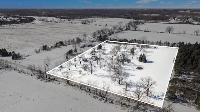 snowy aerial view featuring a rural view