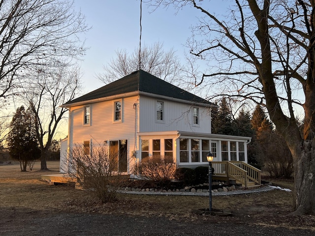 exterior space featuring a sunroom