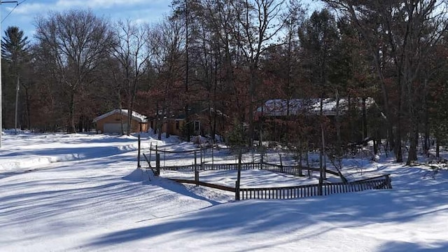 view of yard layered in snow