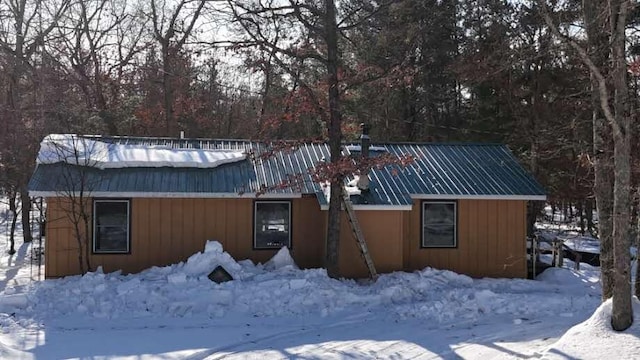 exterior space with metal roof