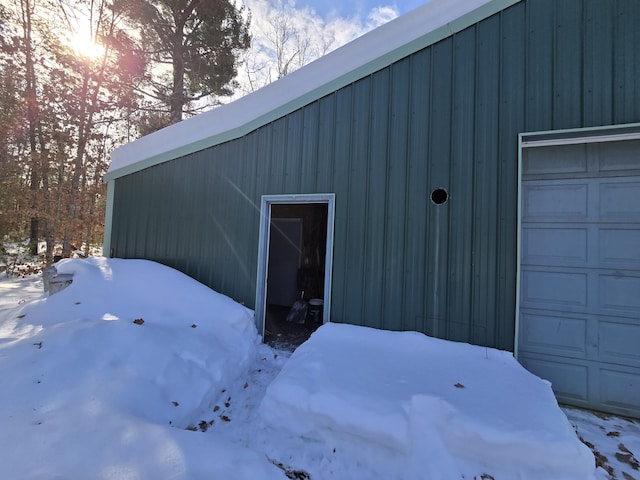 view of snow covered garage