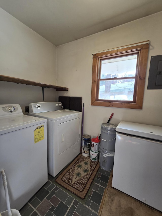 laundry area with washer and dryer, laundry area, and electric panel