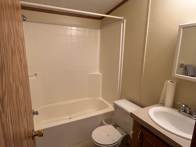 bathroom featuring toilet, vanity, a textured ceiling, and bathing tub / shower combination