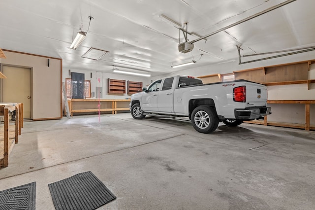 parking garage featuring a garage door opener