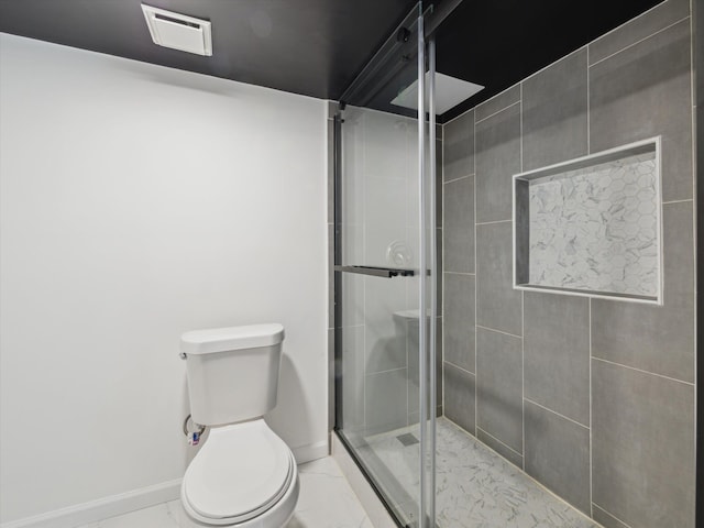 bathroom with a stall shower, baseboards, visible vents, toilet, and marble finish floor