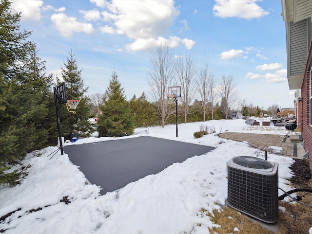 snowy yard with cooling unit