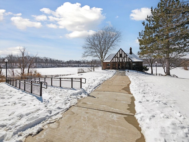 view of community featuring fence