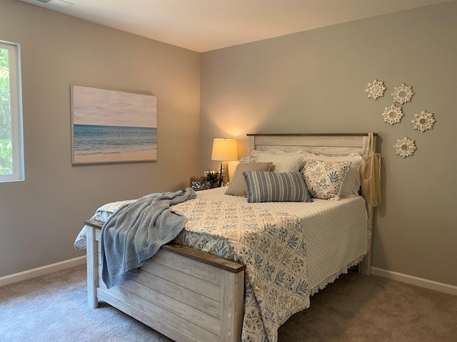 bedroom with carpet and baseboards