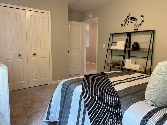 carpeted bedroom featuring a closet, visible vents, and baseboards