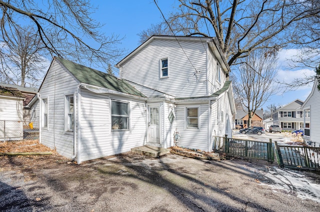 back of property with fence