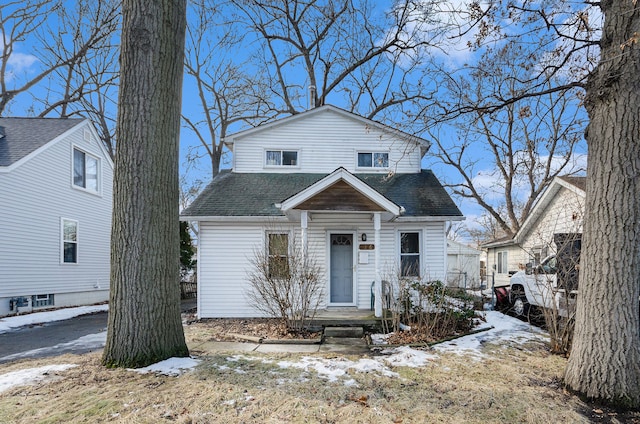 view of front of house with roof with shingles