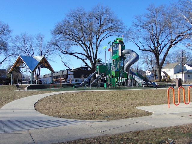 communal playground featuring a lawn