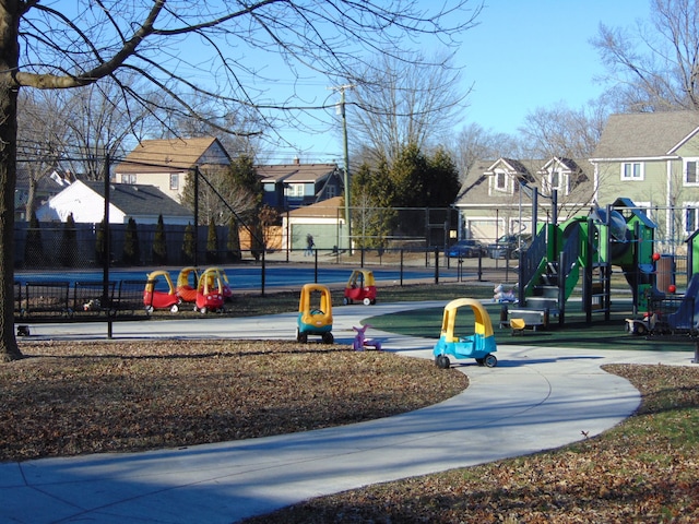 surrounding community featuring a residential view, playground community, and fence