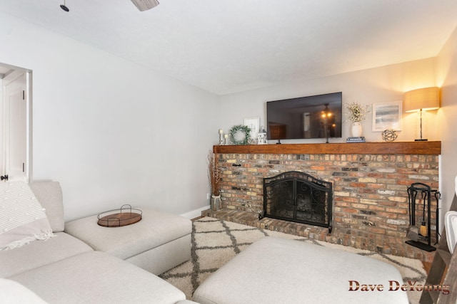 living room with a brick fireplace