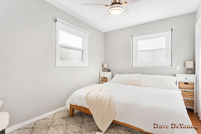 bedroom with baseboards and a ceiling fan