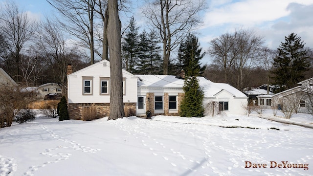 view of front of house featuring a chimney